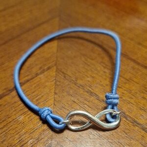 Silver Infinity Bracelet with Blue Cord